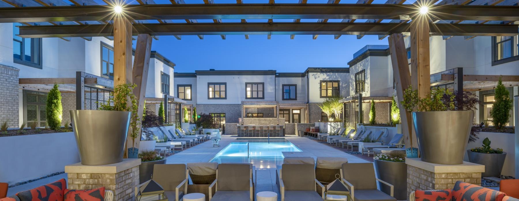 a pool and chairs on a deck