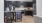 a kitchen with black cabinets