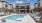a swimming pool with lounge chairs